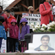 People gather near a photograph of Srinivas Kuchibhotla, the 32-year-old Indian engineer killed at a bar in Olathe, Kan., during a peace vigil in Bellevue, Wash., on March 5, 2017. (Jason Redmond/AFP/Getty Images)